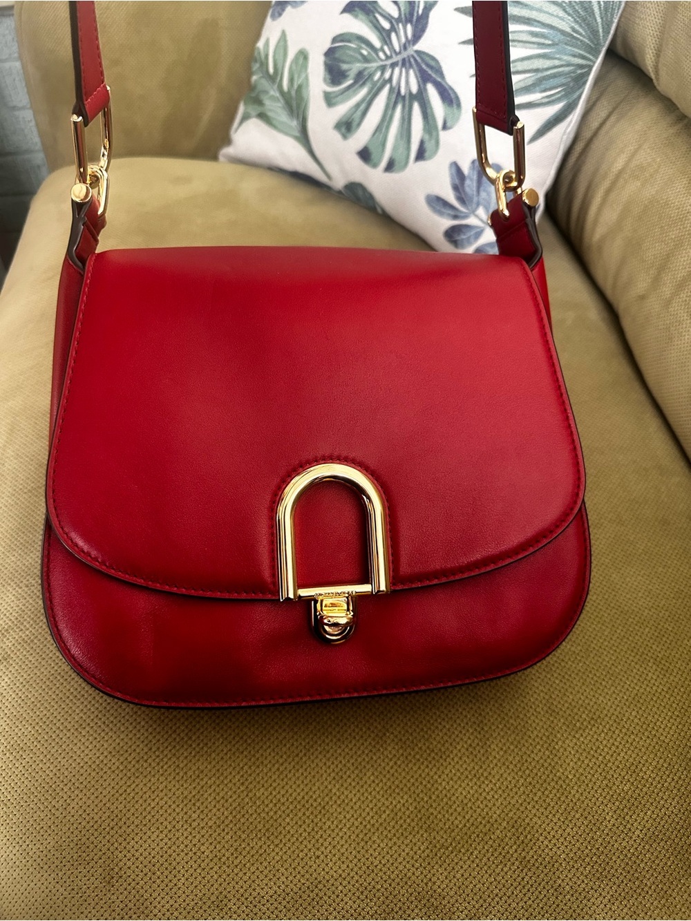 Burgundy red Michael Kors Delfina Saddle Bag with gold-tone hardware